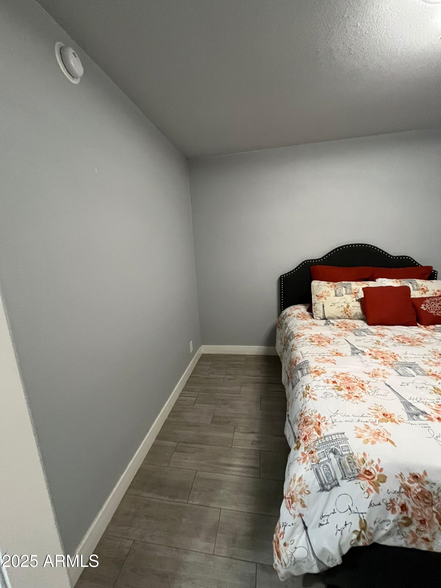 3639 West Lawrence Lane Phoenix, AZ 85051 - Photo 15 of 28 a bedroom with a bed and a window