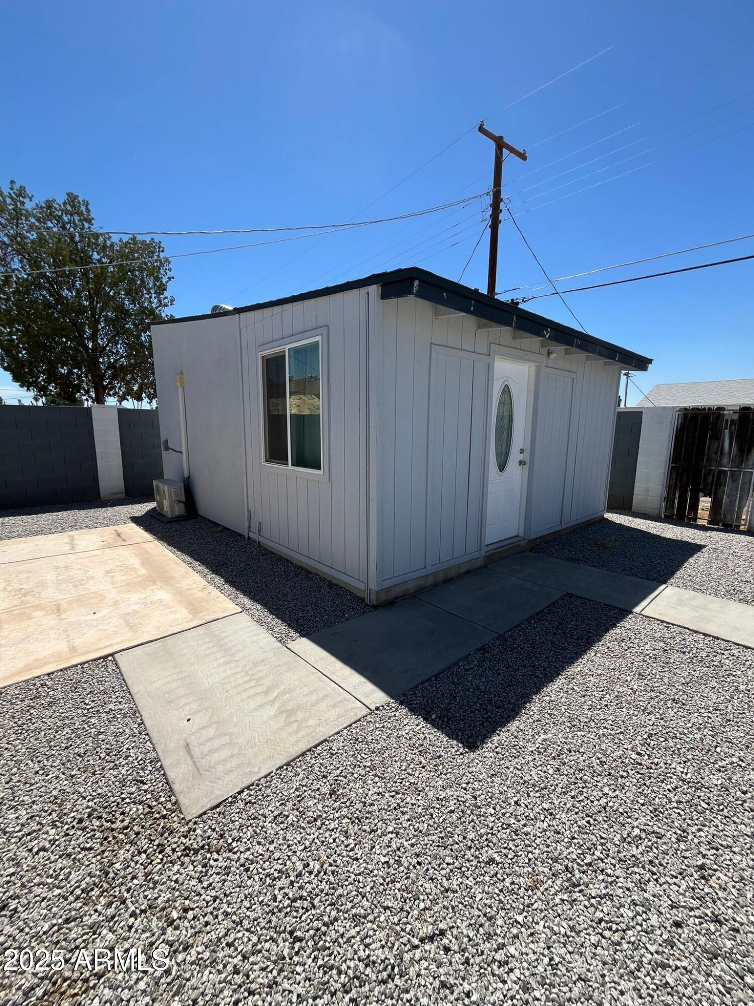 3639 West Lawrence Lane Phoenix, AZ 85051 - Photo 25 of 28 a front view of a house with a yard