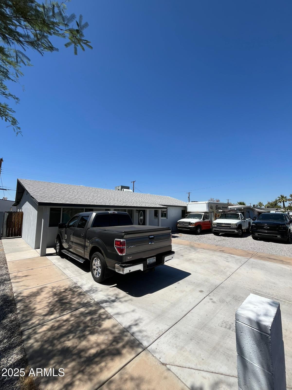 3639 West Lawrence Lane Phoenix, AZ 85051 - Photo 3 of 28 a view of a terrace with chairs