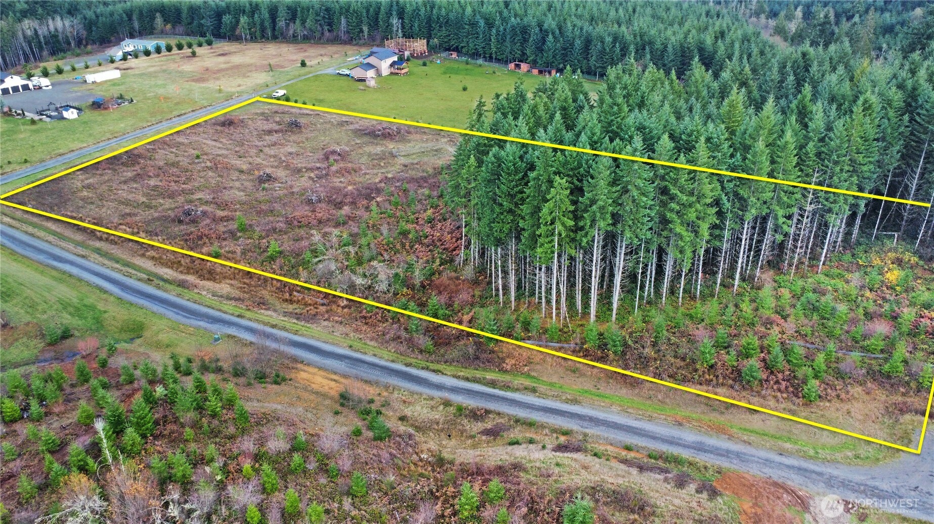 145 Remington Lane Chehalis, WA 98532 - Photo 3 of 8 a view of a backyard with a garden