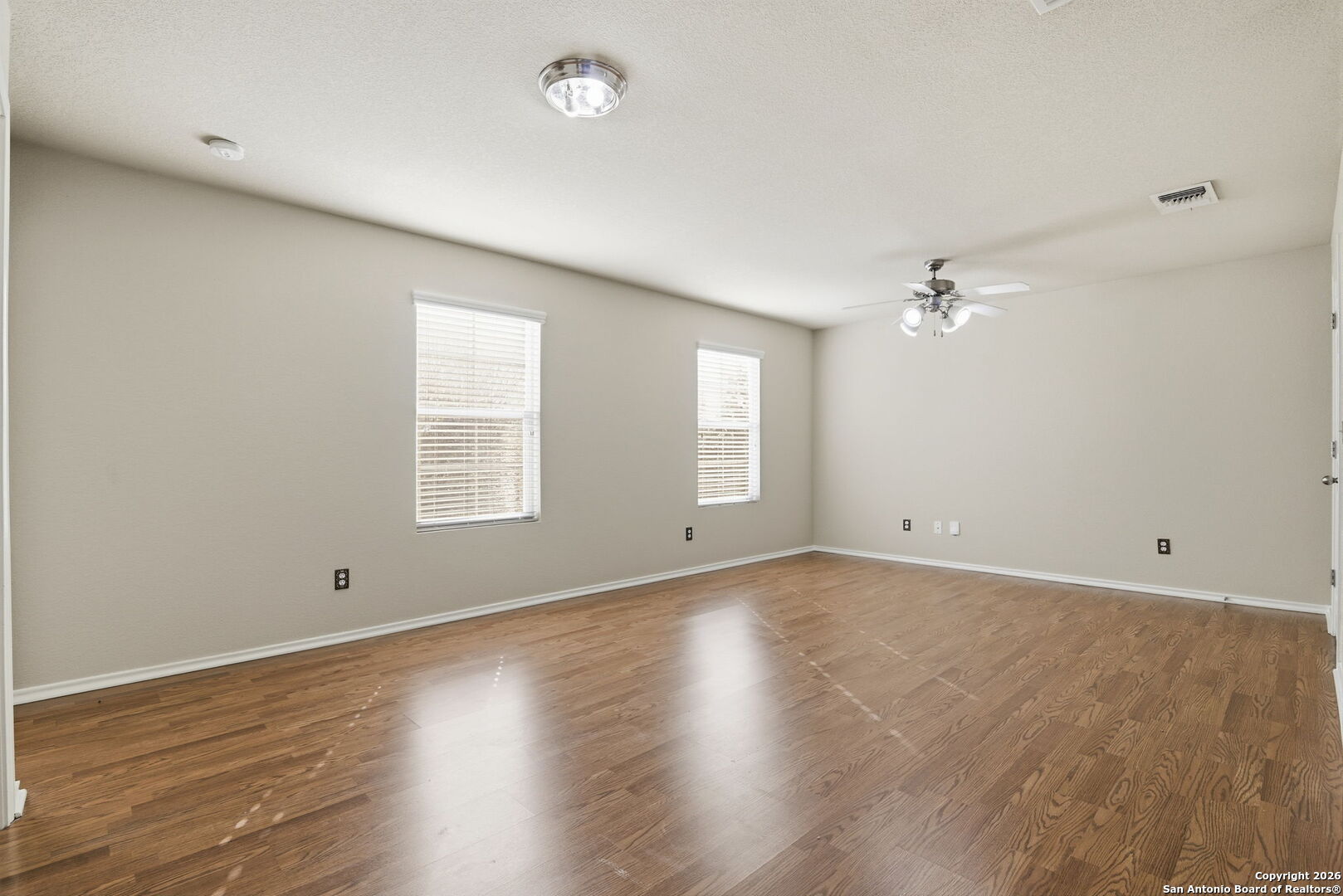 6239 Post San Antonio, TX 78244 - Photo 12 of 21 a view of empty room with wooden floor and fan