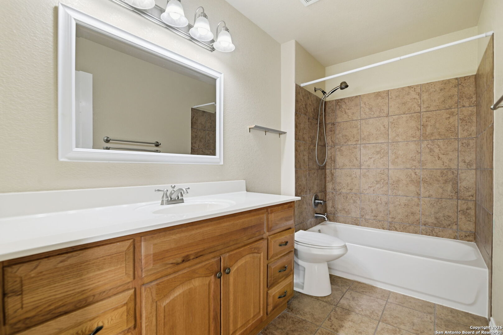 6239 Post San Antonio, TX 78244 - Photo 16 of 21 a bathroom with a sink a toilet and a bathtub