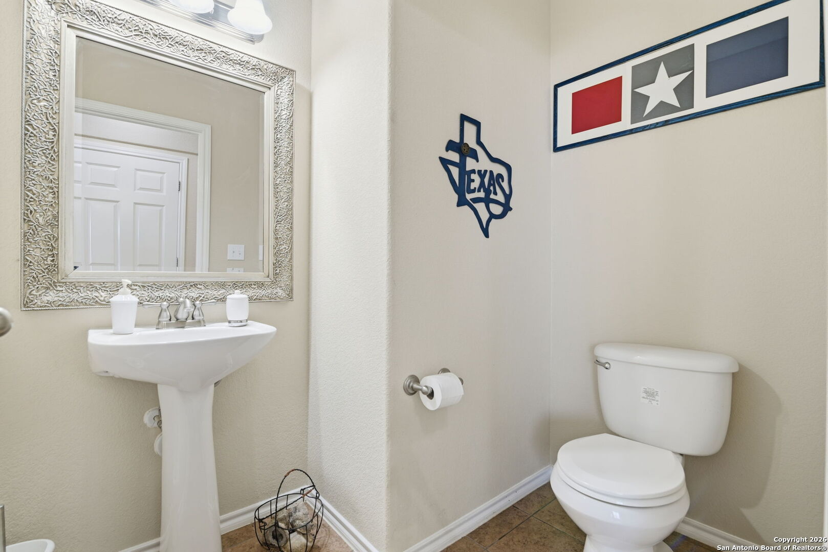 6239 Post San Antonio, TX 78244 - Photo 19 of 21 a bathroom with a toilet sink and mirror