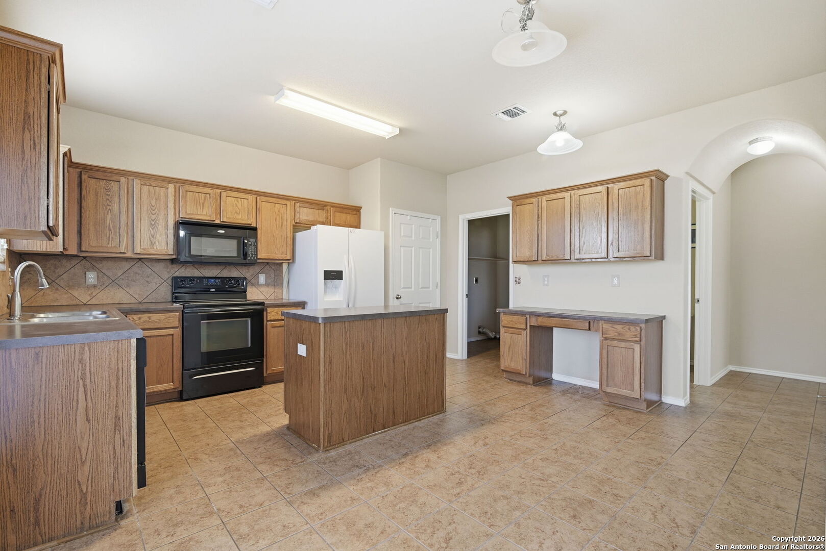 6239 Post San Antonio, TX 78244 - Photo 6 of 21 a large kitchen with cabinets appliances and a counter space