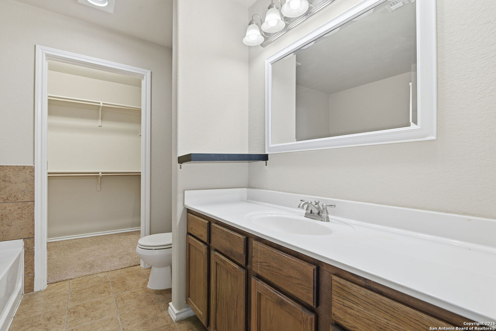 6239 Post San Antonio, TX 78244 - Photo 10 of 21 a bathroom with a sink a toilet and a mirror