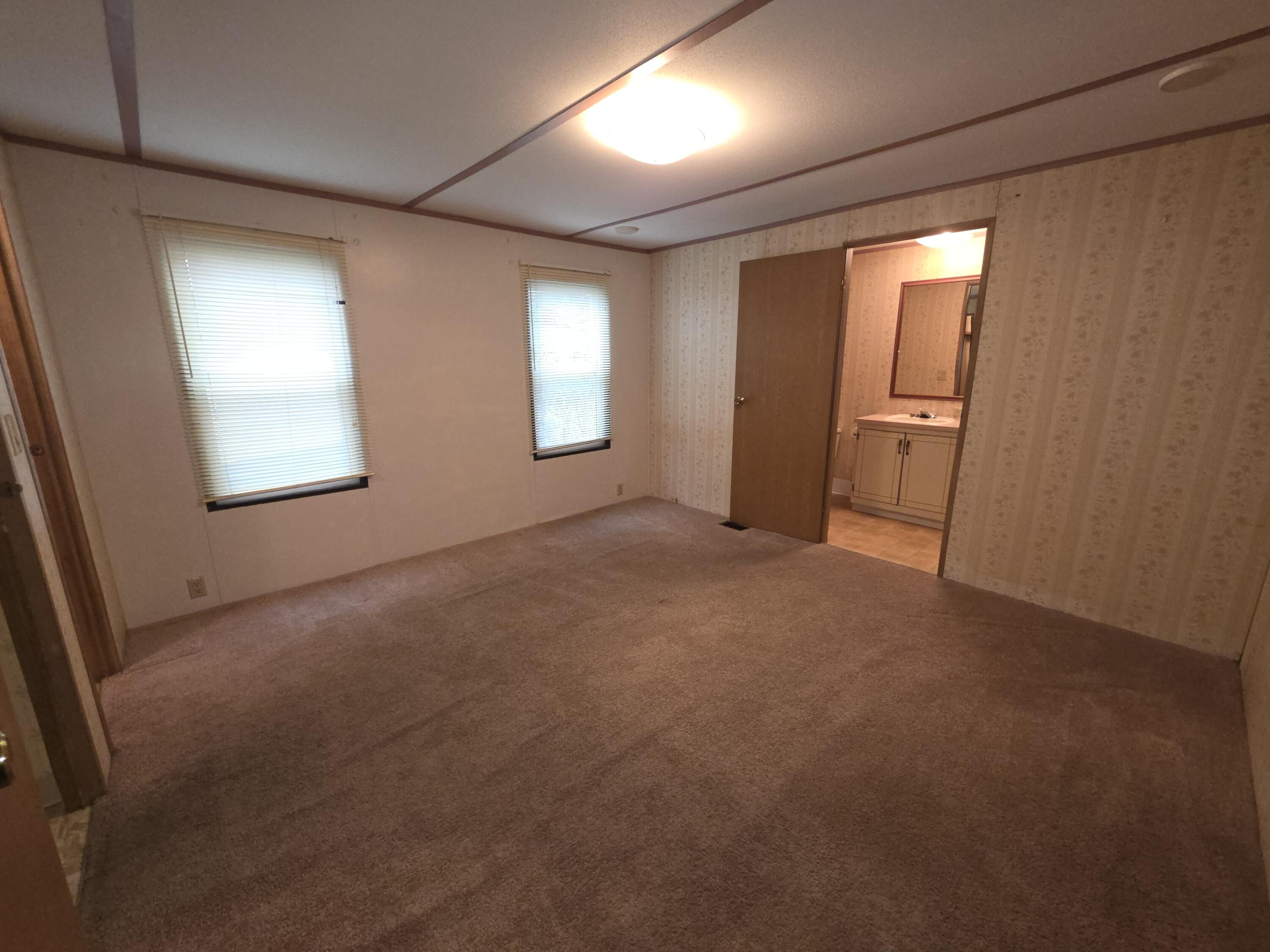 301 Freeman Road, Unit 30 Central Point, OR 97502 - Photo 6 of 26 an empty room with windows