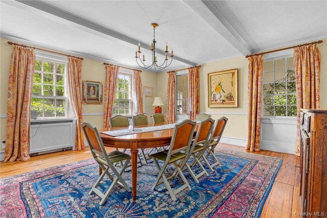 1282 Hollow Road Clinton Corners, NY 12514 - Photo 12 of 34 a view of a dining room with furniture window and wooden floor