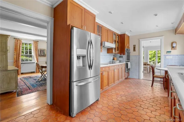 a kitchen with stainless steel appliances a refrigerator and a stove