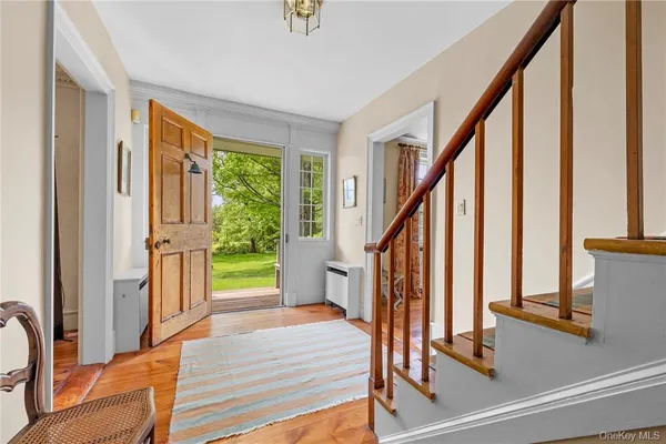 a view of a porch with wooden floor and windows