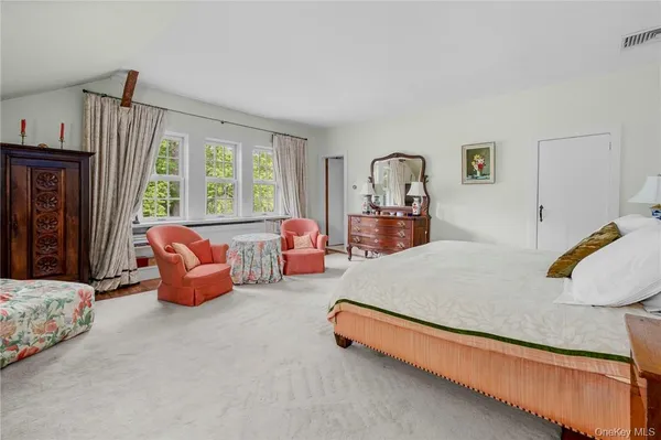 a bed room with furniture and a window
