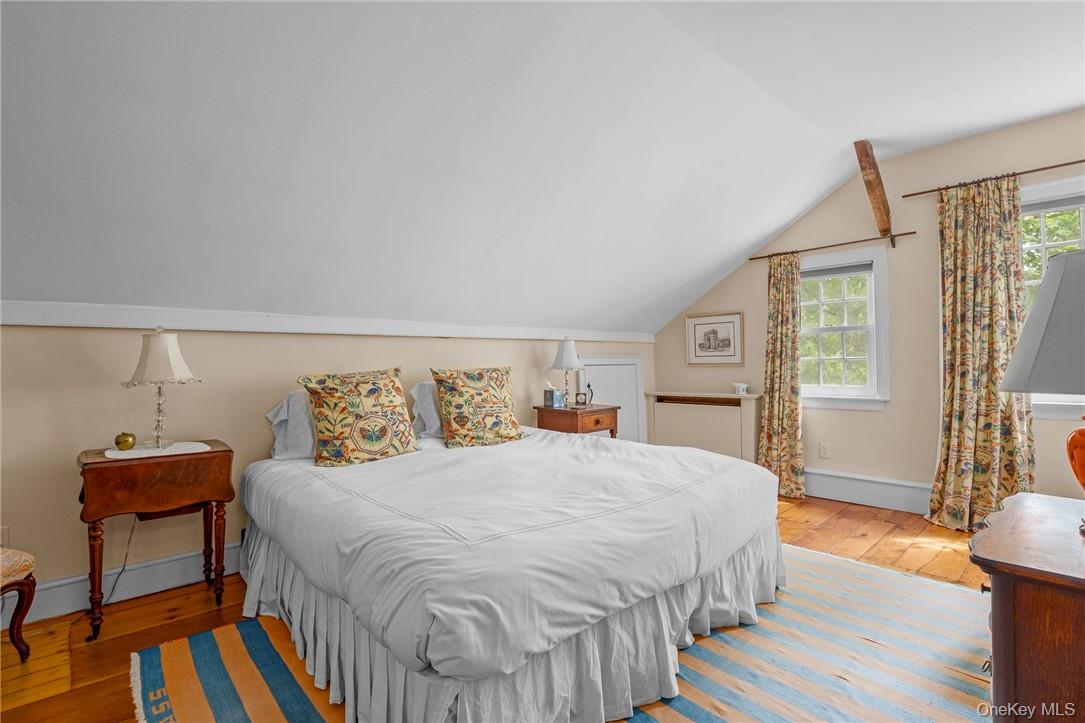 1282 Hollow Road Clinton Corners, NY 12514 - Photo 22 of 34 a bedroom with a bed and wooden floor