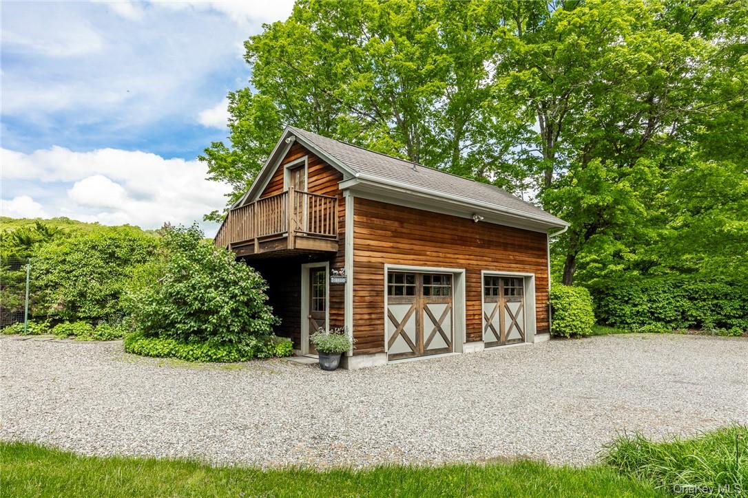 1282 Hollow Road Clinton Corners, NY 12514 - Photo 25 of 34 a front view of a house with a yard and garage