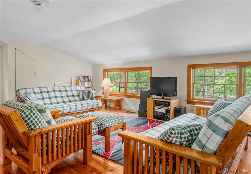 1282 Hollow Road Clinton Corners, NY 12514 - Photo 27 of 34 a bedroom with furniture and a flat screen tv