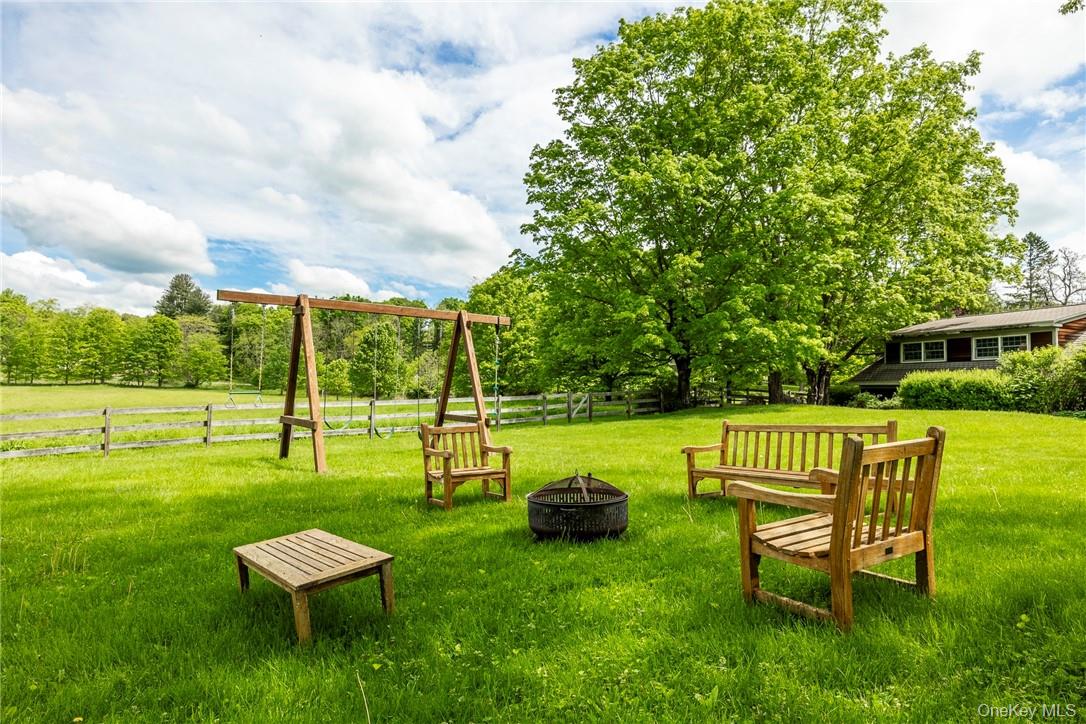 1282 Hollow Road Clinton Corners, NY 12514 - Photo 30 of 34 a view of a big yard with swimming pool and a bench
