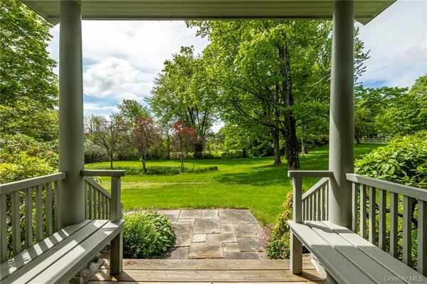 a view of a deck with a yard