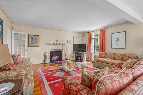 a bedroom with a bed and a fireplace