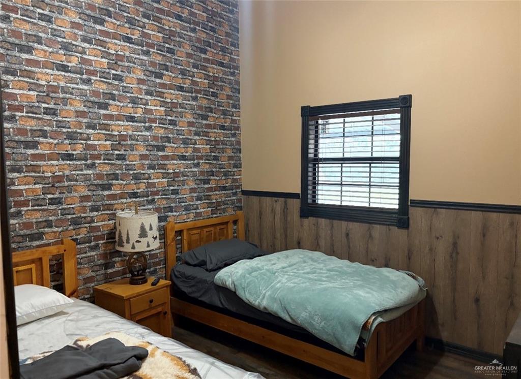 218 Cr 218 Road Encino, TX 78353 - Photo 7 of 16 a bedroom with a bed and a window