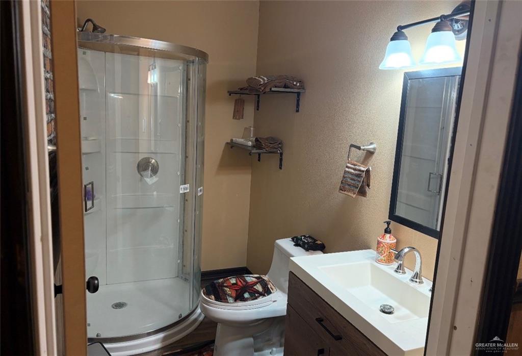 218 Cr 218 Road Encino, TX 78353 - Photo 8 of 16 a bathroom with a sink toilet and shower