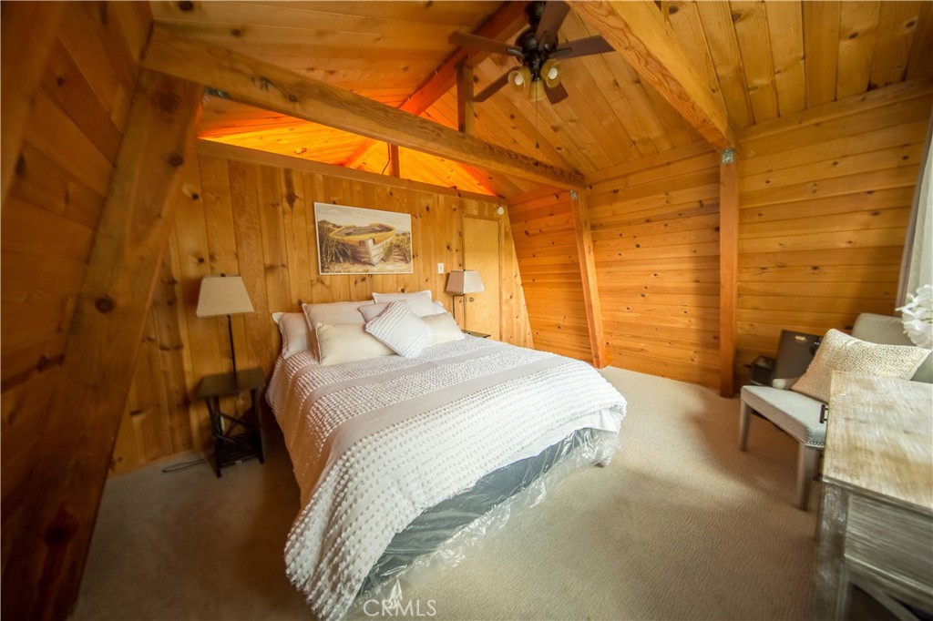 512 Shady Dell Crestline, CA 92325 - Photo 20 of 42 a bedroom with a bed and a mirror