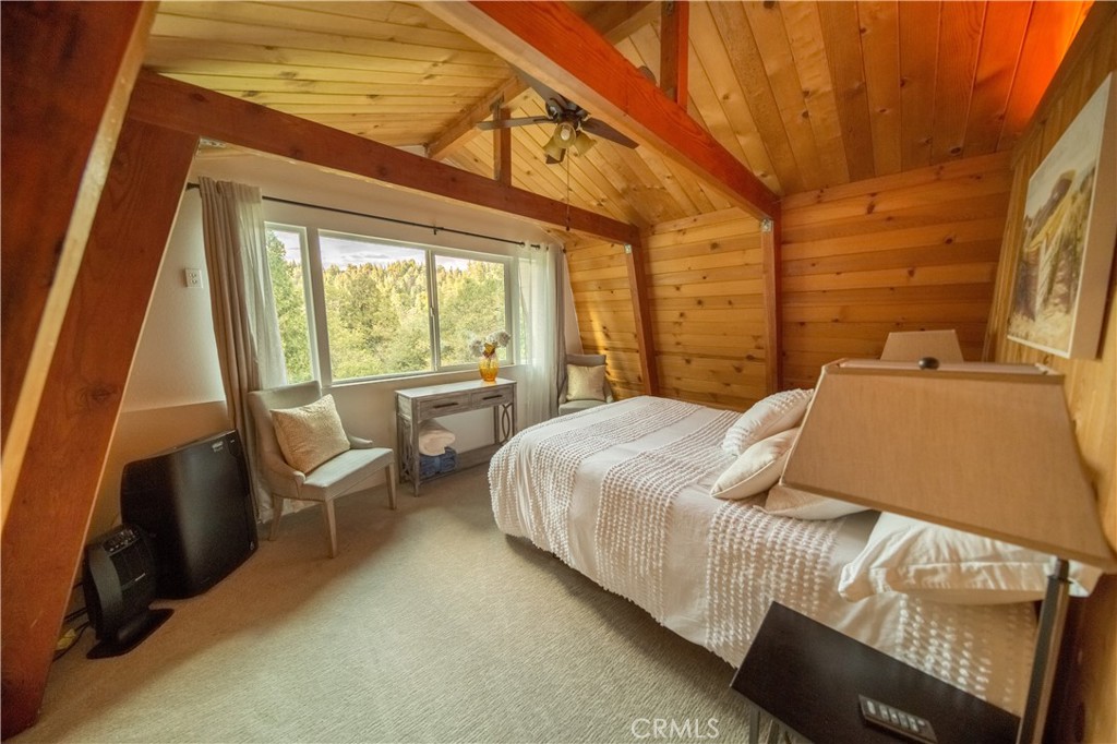 512 Shady Dell Crestline, CA 92325 - Photo 21 of 42 a bedroom with a bed and wooden floor