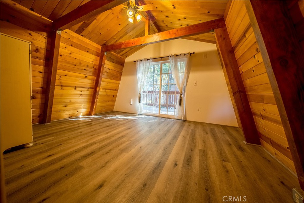 512 Shady Dell Crestline, CA 92325 - Photo 24 of 42 a view of an empty room with wooden floor and a window