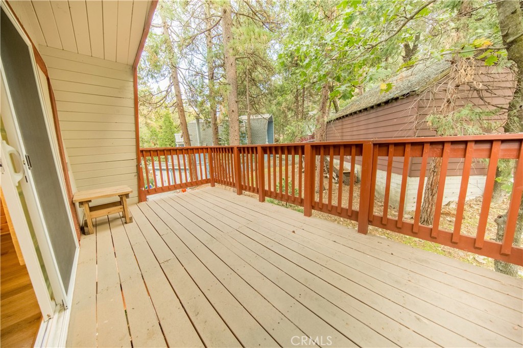 512 Shady Dell Crestline, CA 92325 - Photo 26 of 42 a balcony with wooden floor and fence