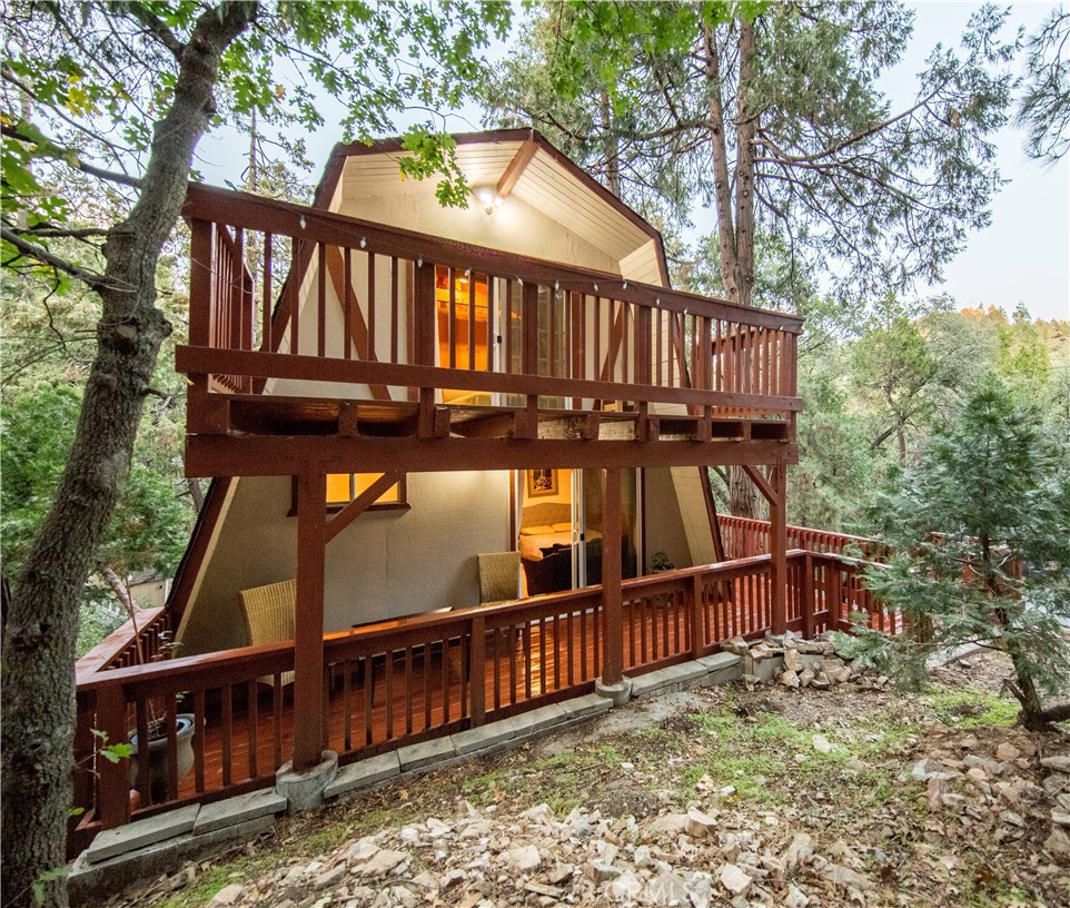 512 Shady Dell Crestline, CA 92325 - Photo 30 of 42 a view of a wooden house with large trees and wooden fence