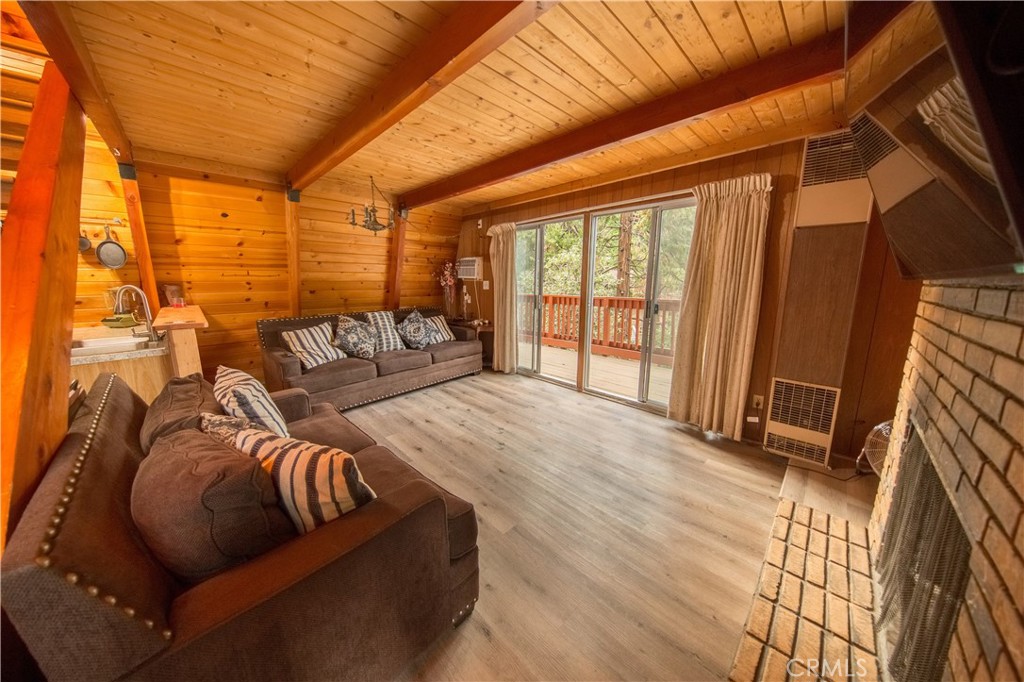 512 Shady Dell Crestline, CA 92325 - Photo 5 of 42 a bedroom with furniture and a large window