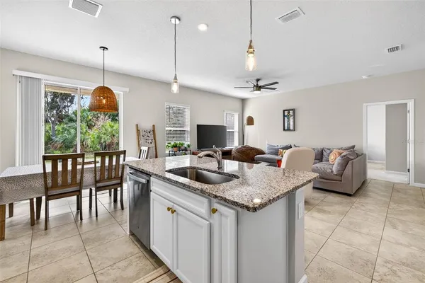a kitchen with living room and living room view