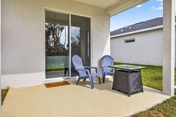 a view of a two chairs in the patio