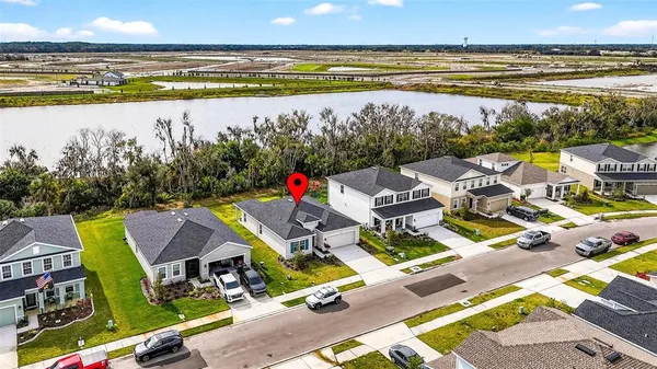 an aerial view of a houses and an outdoor space