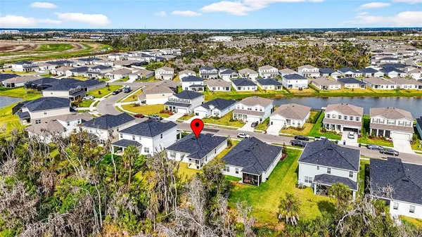 an aerial view of a house with outdoor space