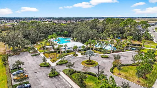 an aerial view of a house with garden space and street view