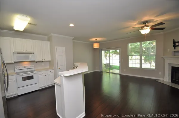 a kitchen with a stove a sink and a refrigerator