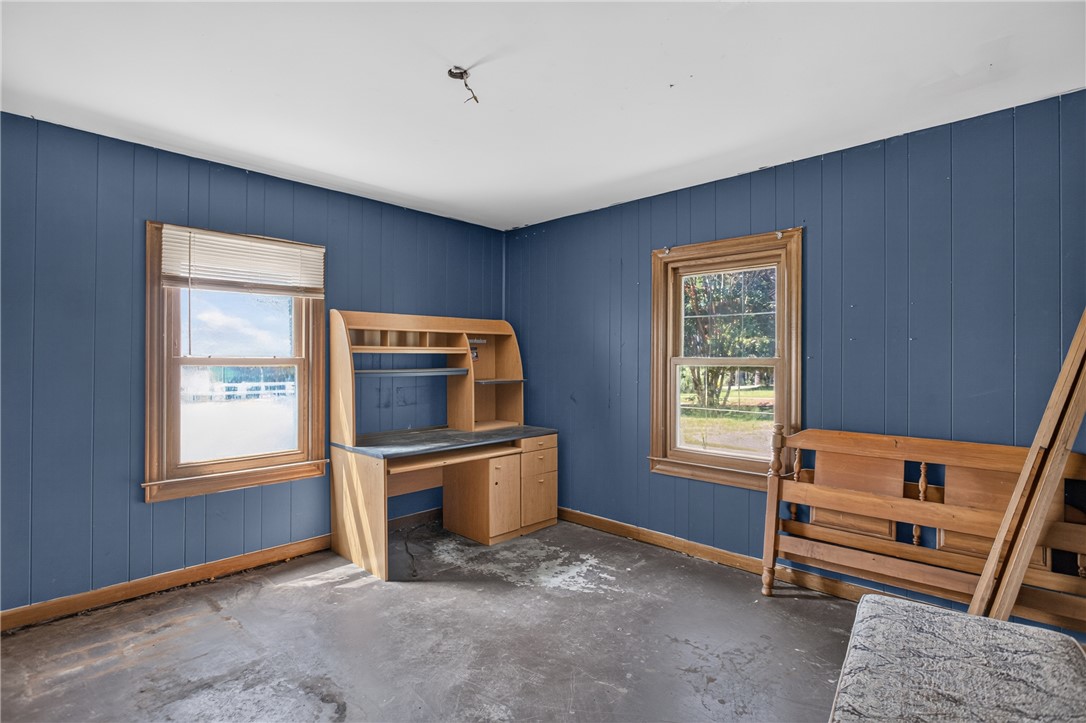 1719 Old Central Road Central, SC 29630 - Photo 28 of 45 Natural light streams through wood-framed windows into a versatile room featuring classic paneled walls.