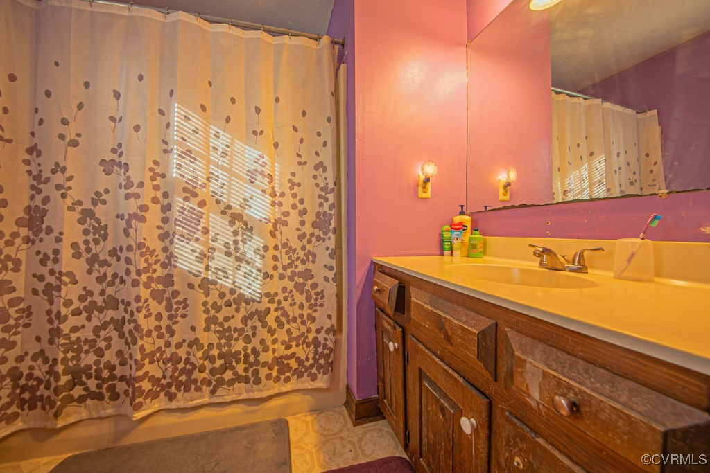 7570 Elko Road Henrico, VA 23231 - Photo 14 of 20 Bathroom featuring tile patterned flooring and van