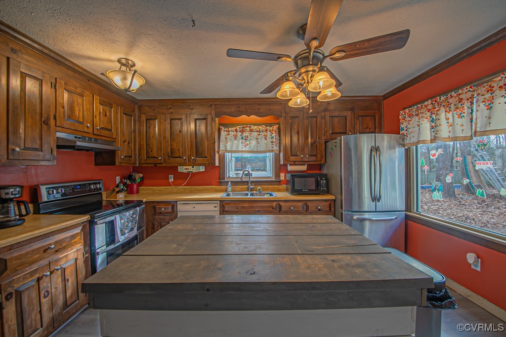 7570 Elko Road Henrico, VA 23231 - Photo 8 of 20 Kitchen featuring sink, a center island, black app
