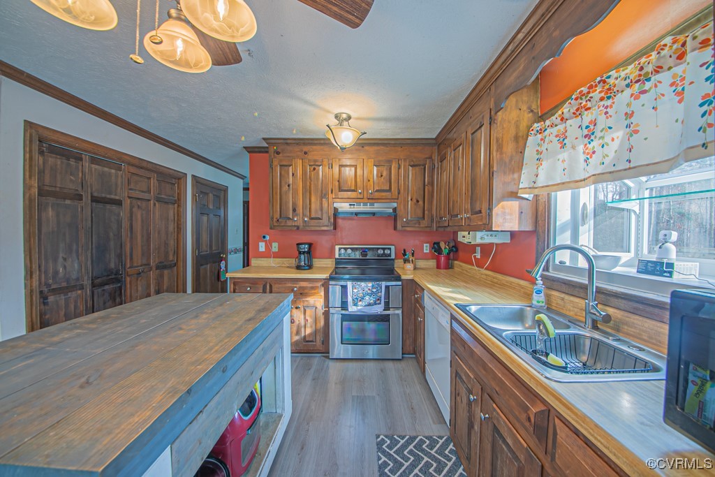 7570 Elko Road Henrico, VA 23231 - Photo 9 of 20 Kitchen with dishwasher, sink, butcher block count