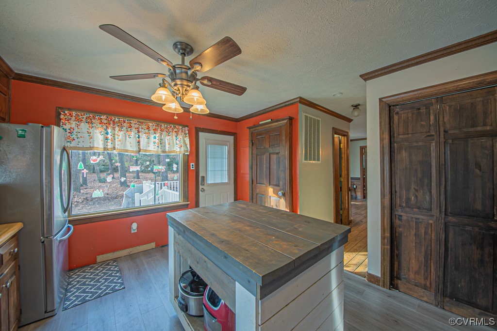 7570 Elko Road Henrico, VA 23231 - Photo 10 of 20 Kitchen featuring wood counters, ceiling fan, crow