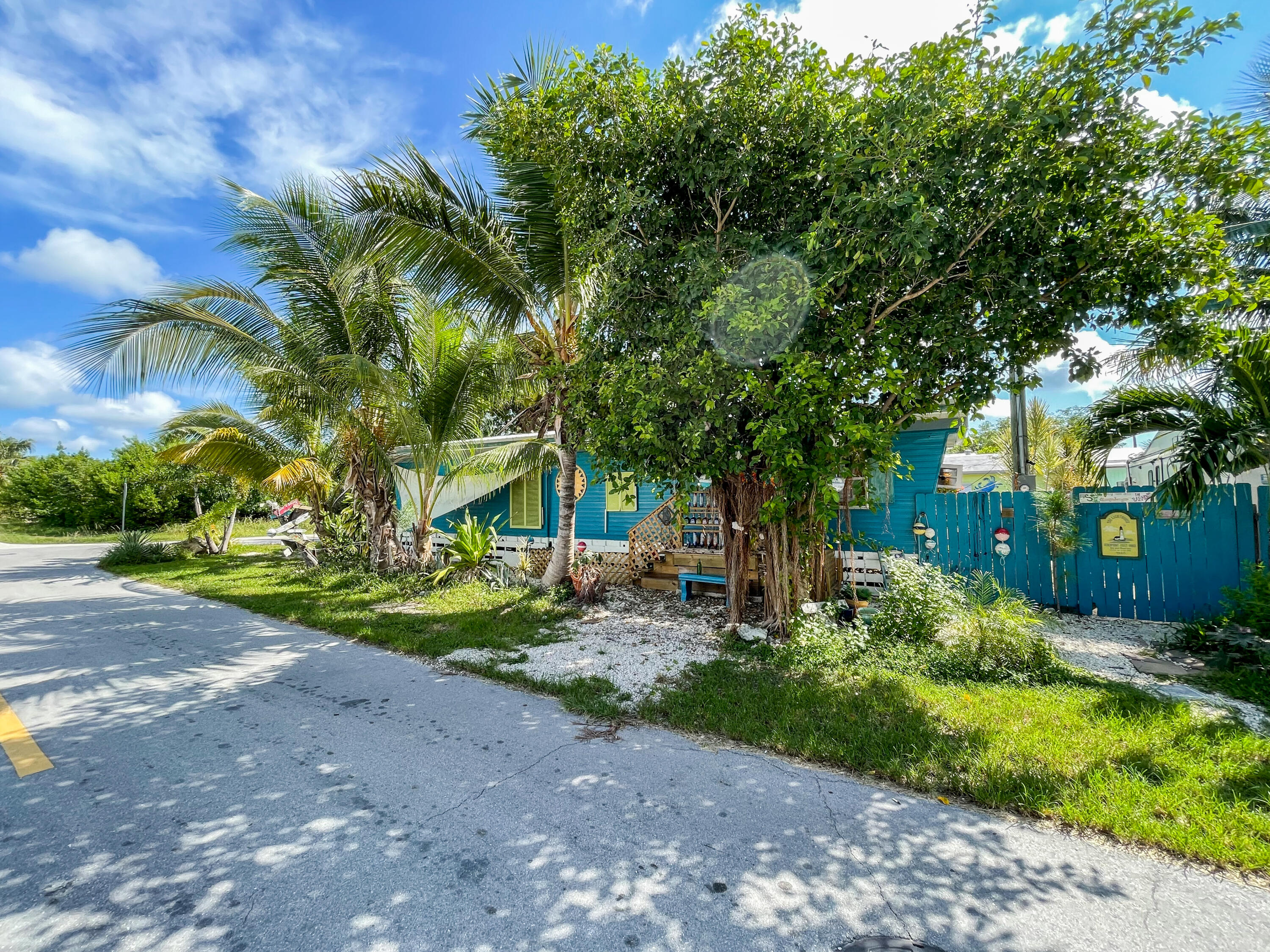 31316 Ave C Big Pine Key, FL 33043 - Photo 1 of 28 a front view of a house with garden