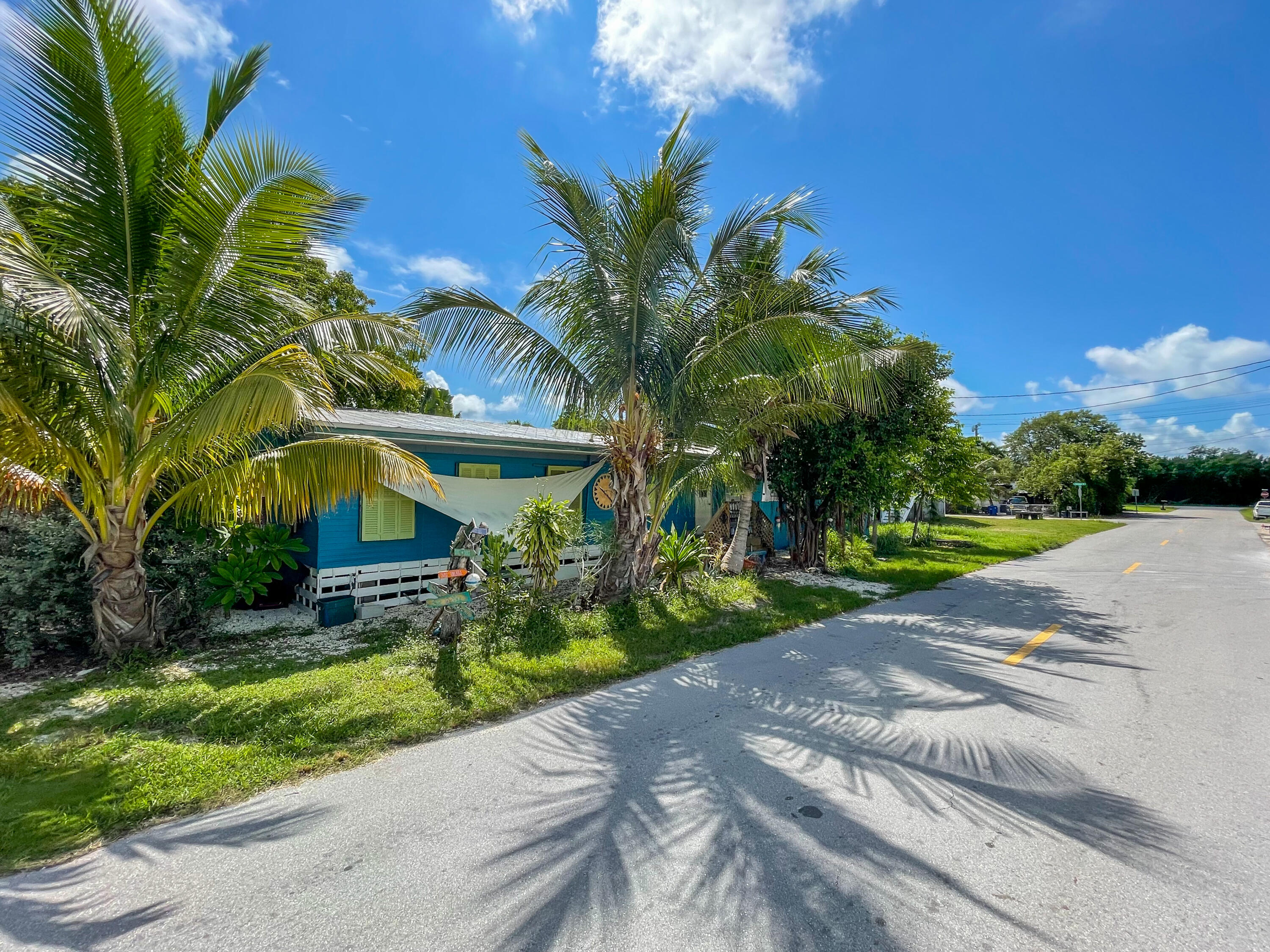 31316 Ave C Big Pine Key, FL 33043 - Photo 15 of 28 a view of a yard with plants and trees