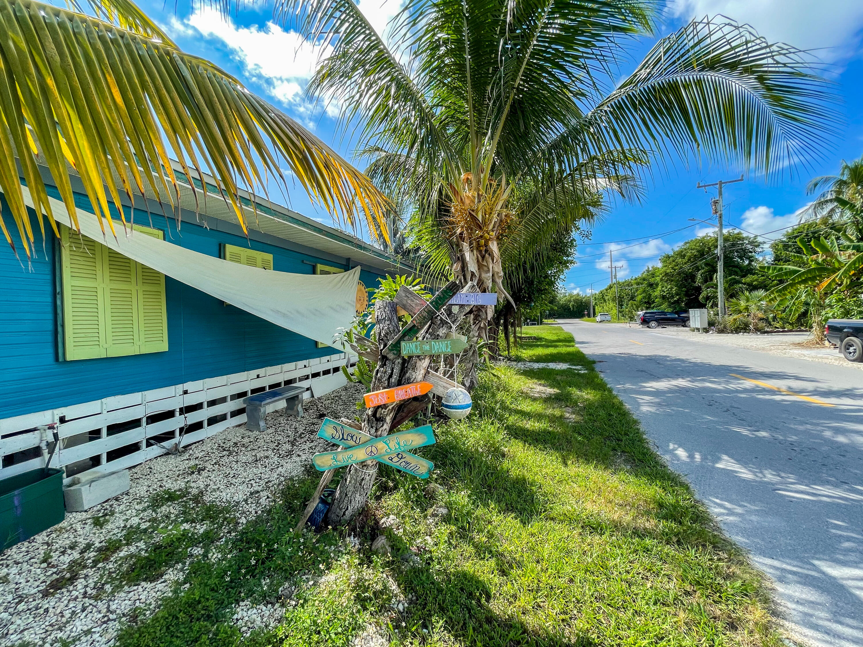 31316 Ave C Big Pine Key, FL 33043 - Photo 8 of 28 a backyard of a house with lots of green space
