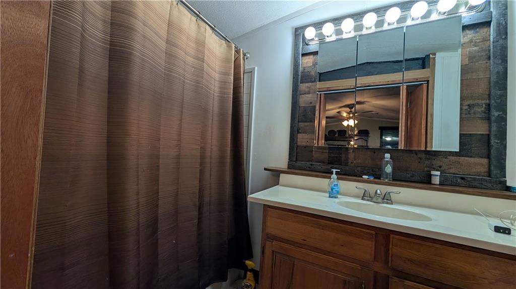 203 Colvin Road Greensboro, PA 15338 - Photo 8 of 20 a bathroom with a double vanity sink and a mirror