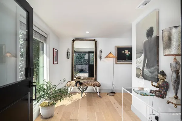 a room with furniture and a potted plant