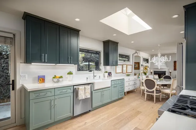 a kitchen with a sink cabinets and window