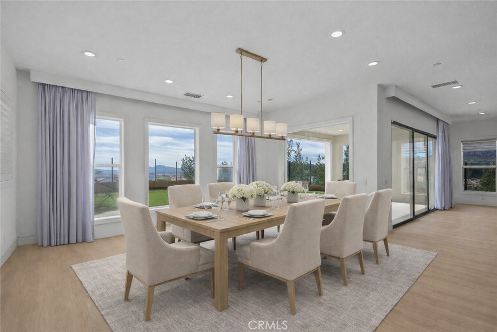 20638 Deer Grass Court Porter Ranch, CA 91326 - Photo 6 of 50 a view of a dining room with furniture window and outside view