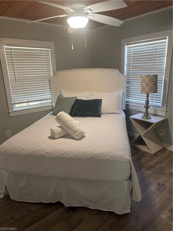 981 8th Terrace North Naples, FL 34102 - Photo 11 of 13 a bedroom with a bed and window