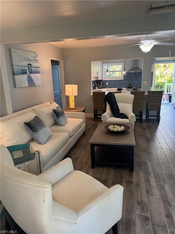 981 8th Terrace North Naples, FL 34102 - Photo 4 of 13 a living room with furniture and a large window