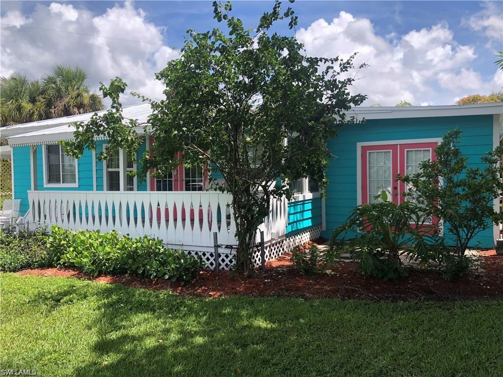 981 8th Terrace North Naples, FL 34102 - Photo 5 of 13 a view of a house with a yard and garden