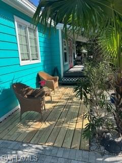 981 8th Terrace North Naples, FL 34102 - Photo 6 of 13 a backyard of a house with table and chairs